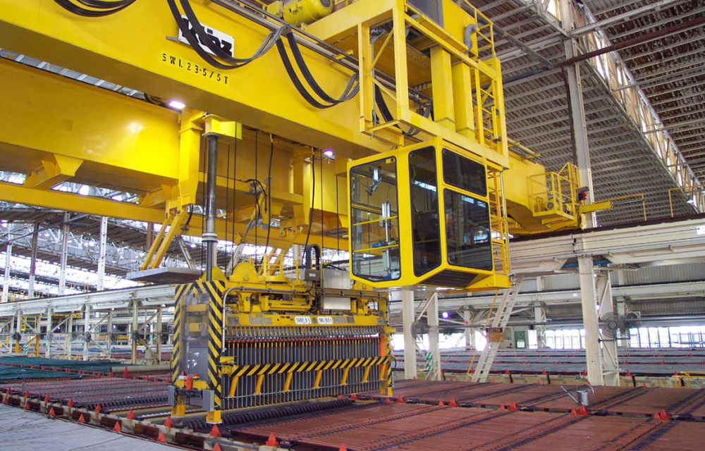 An automated overhead crane at Copper Refineries Limited in Townsville, where Glencore’s ISAKIDD technology supports high-throughput electrorefining operations.
