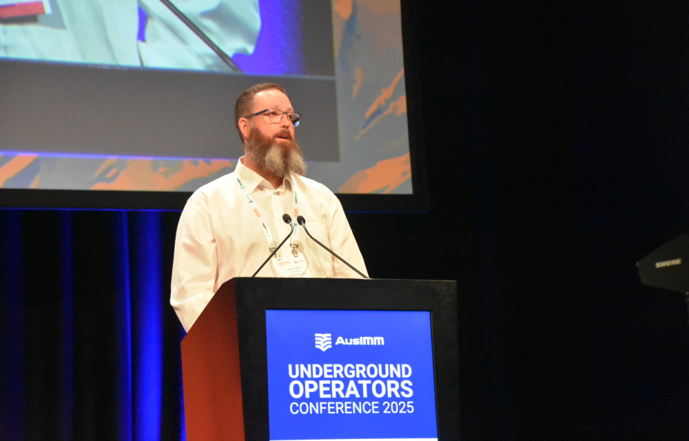 Dave Tomek presenting at the 2025 AusIMM Underground Operators Conference in Adelaide, describing the evolution of the Stope Soaker 2000 from Facebook post to prototype. Photo: Jamie Wade.