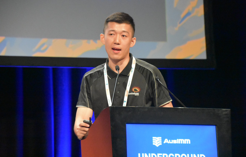 Eddy Zhang presents insights from Ernest Henry’s sublevel cave reorientation at the UGOPS 2025 conference.