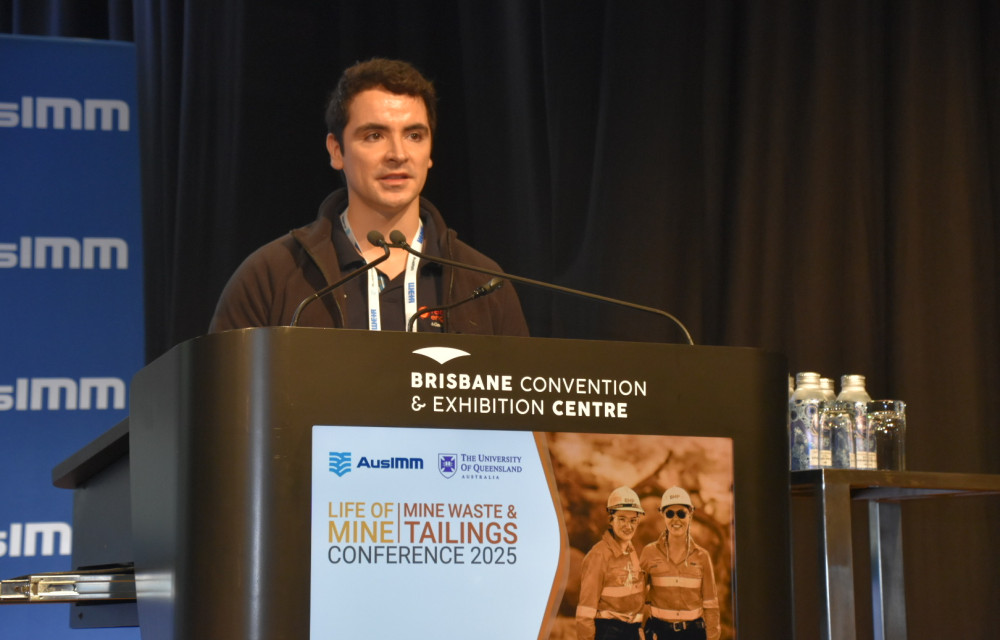 Martin Rojas of Red Earth Engineering presenting at the Life of Mine | Mine Waste and Tailings 2025 conference in Brisbane on automating QA workflows for tailings dam construction.