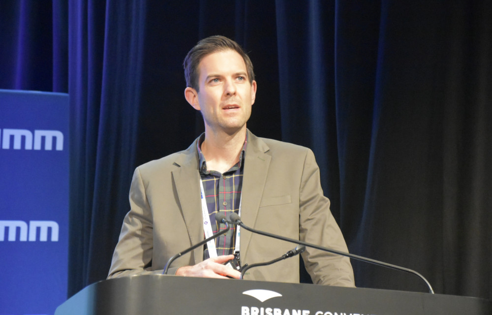 Jarrad Coffey speaks at Life of Mine 2025 in Brisbane, presenting on the complexities of applying critical control frameworks to tailings risk management.