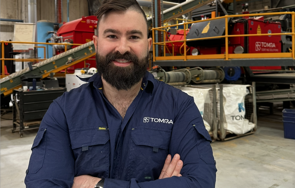TOMRA technician demonstrating sensor-based ore sorting system for gold recovery at Sydney test centre