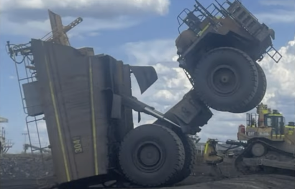 Water cart tilted backwards during stand movement incident at Wilpinjong coal mine, highlighting safety and engineering lessons.