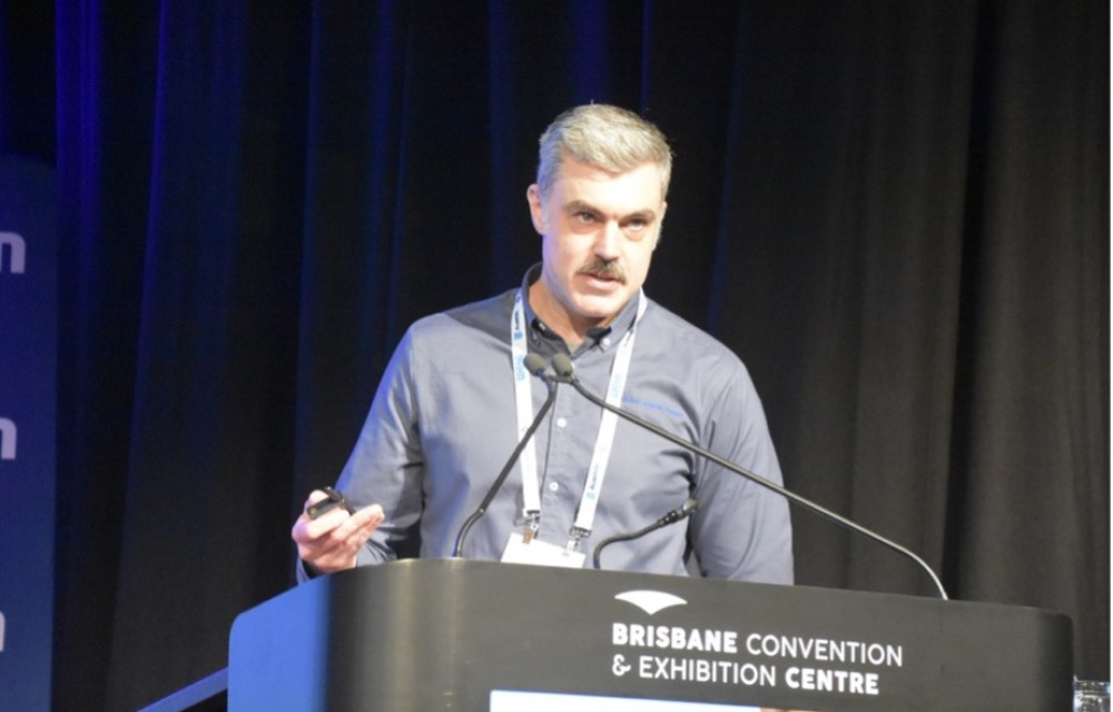James Penman presenting on hydro-cyclone classification and how cyclone sand dams could reshape tailings management in Australia.