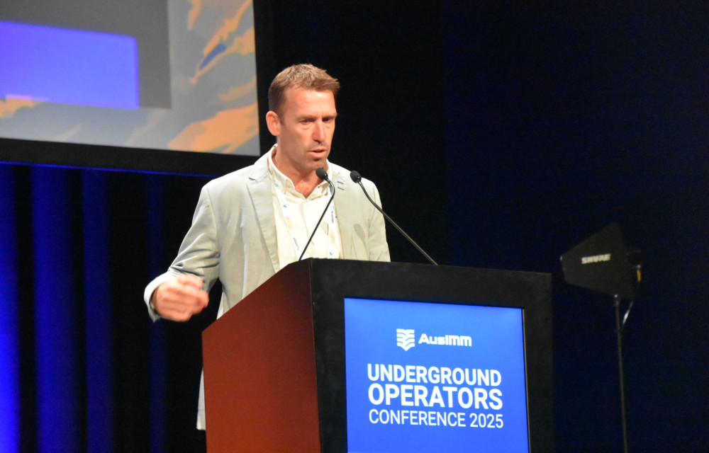 Dr Matthew Helinski presenting at UGOPS 2025 on paste fill optimisation and dilution cost trade-offs in underhand stoping design.